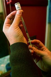 Preparing a flu shot. Image courtesy Steven Depolo flickr creative commons